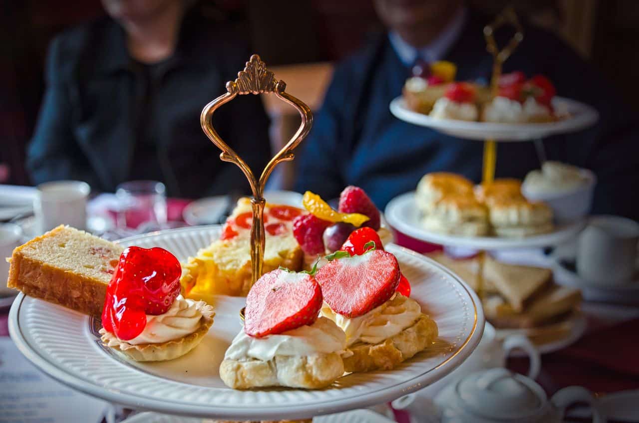 Worcester Whitehouse Hotel Afternoon Tea in Worcester Blog Image image of top of cake stand with scones and strawberries